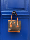 Céline Bucket — Toile Macadam brun, sangles bouclées
