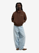 Le pantalon ballon en denim clair délavé