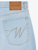 Le pantalon flare en denim clair délavé